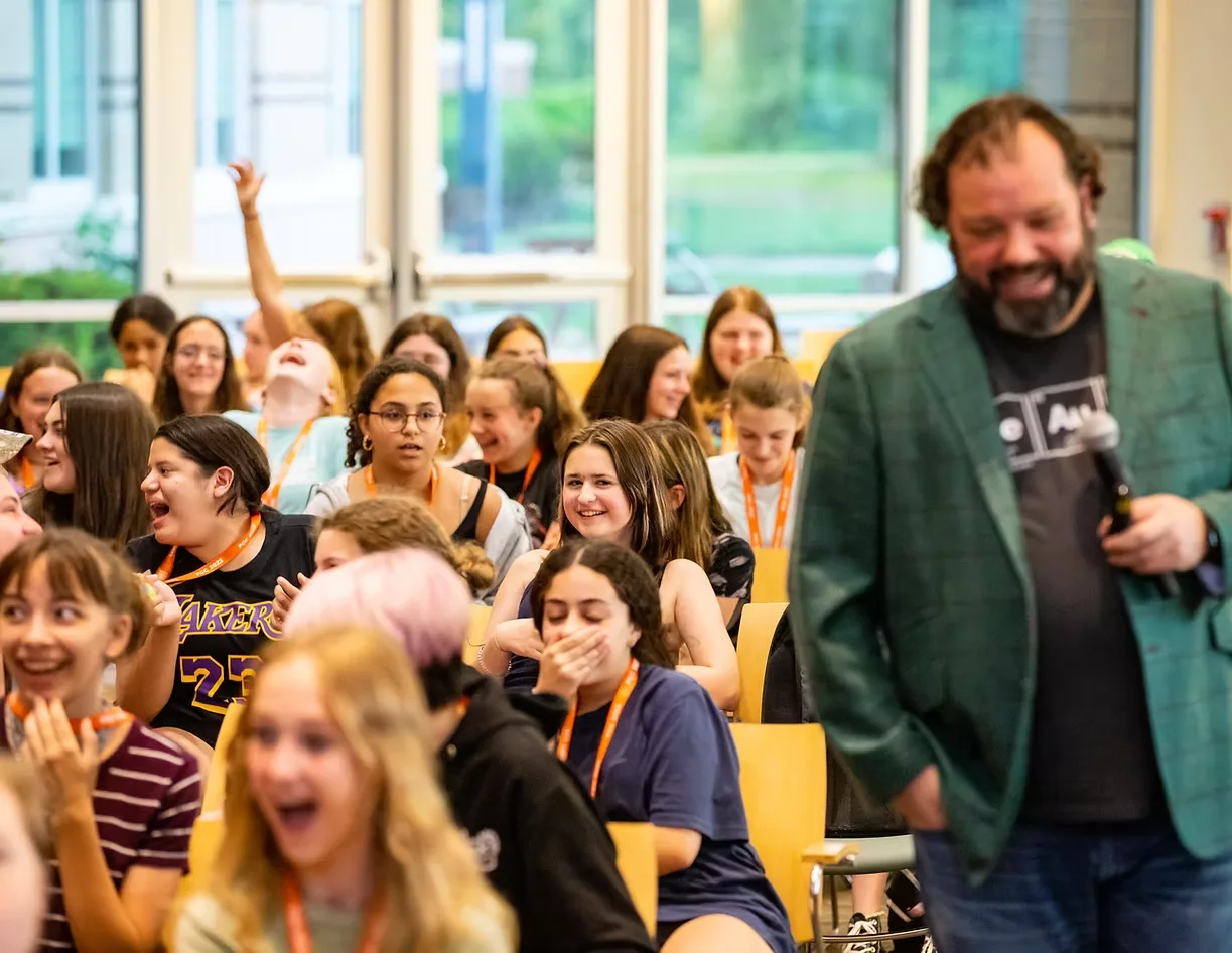 Joshua Peach with a laughing audience